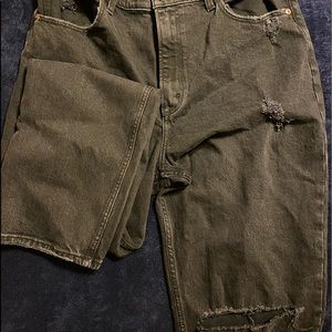 Hi rise straight leg black jeans with rips in the knees